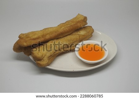 A plate of Cakwe or Cakue. Cakwe is one of the traditional Chinese snacks with a savory taste