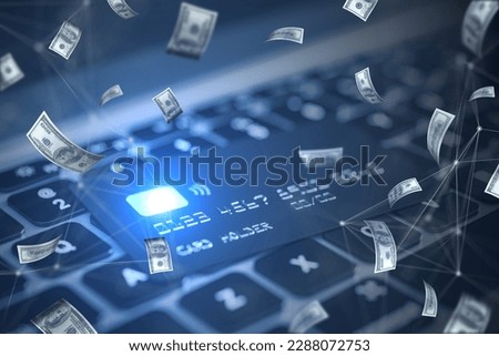 Close up of laptop keyboard and bank card with blurry flying dollar bills. Finance, success and casino concept
