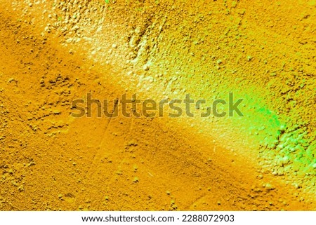 A fragment of colorful graffiti painted on a wall. Abstract urban background for design. Spray painting art.