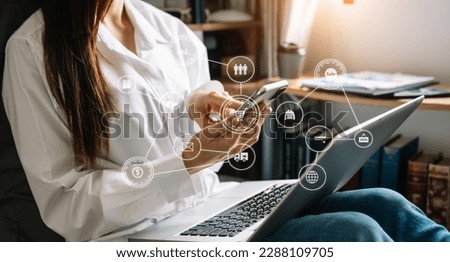 Woman using smart phone for mobile payments online shopping,omni channel,sitting on table,virtual icons graphics interface screen 
 Royalty-Free Stock Photo #2288109705