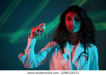 Medicine. Doctor holding a medicine bottle in hands