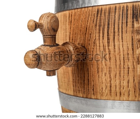 Oak barrel with metal hoops and tap isolated on white background