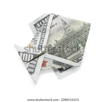 Origami fish made of dollar banknotes on white background