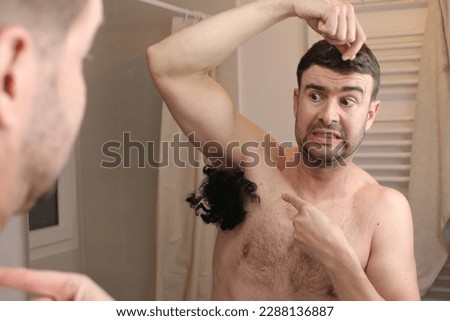 Man with excessive armpit hair 