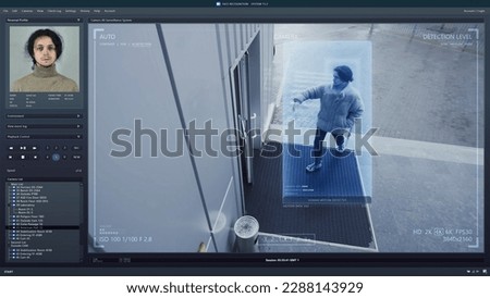 Playback CCTV camera on computer screen. Outside security camera of business office. AI program with facial recognition and personal profiles. Face scanning system. Digital surveillance and tracking. Royalty-Free Stock Photo #2288143929
