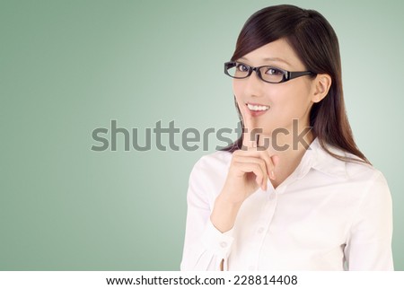 Silent gesture by businesswoman with smile.