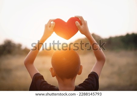 boy hands holding hearts silhouette