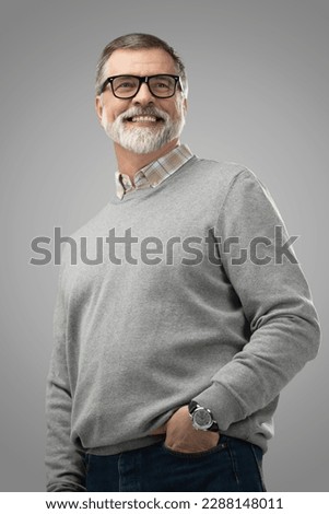 Portrait of happy casual mature man smiling, senior age man with gray hair, Isolated on gray background Royalty-Free Stock Photo #2288148011