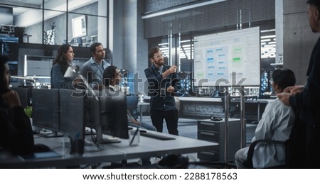 Team of Multiethnic Indian Software Engineers Having a Meeting in Order to Review the Code Done by Computer Engineering Department. Colleague Making a Presentation for Project Managers at the Office Royalty-Free Stock Photo #2288178563