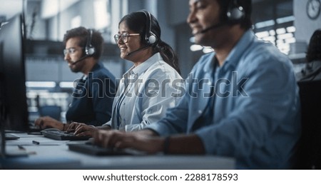Positive Technical Support Managers Talking on Calls, Providing Help Desk Solutions to Customers Experiencing Troubleshooting Issues with a Product. Indian Specialists Successfully Solving Problems Royalty-Free Stock Photo #2288178593