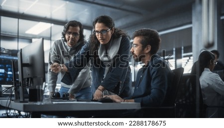 Team of Three Diverse South Asian Software Developers Talk, Discuss a Technological Project. Empowered Indian Female Specialists and Two Colleagues Work on Digital Software as a Service Business Royalty-Free Stock Photo #2288178675