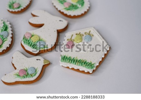 A table with decorated Easter cookies on it