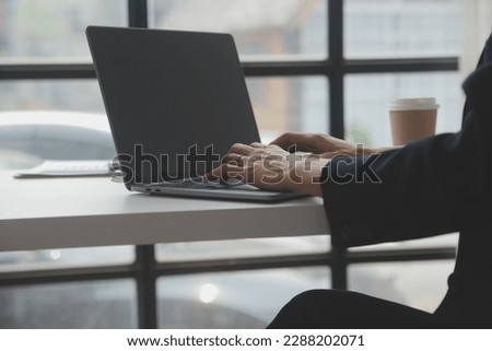 Business professionals. Group of young confident business people analyzing data using computer while spending time in the office