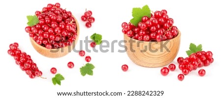 Red currant berries in a wooden bowl with leaf isolated on white background Royalty-Free Stock Photo #2288242329
