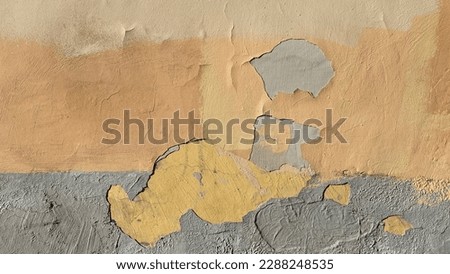 Yellow peeling paint on the wall. Old concrete wall with cracked flaking paint. Weathered rough painted surface with patterns of cracks and peeling Royalty-Free Stock Photo #2288248535