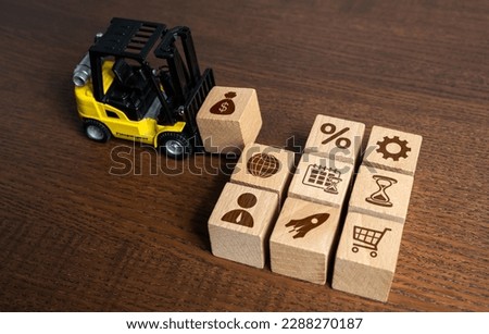 A forklift assembles components for a business. Build your successful business plan. Enhance opportunities. Investments for project implementation. Entrepreneurship.