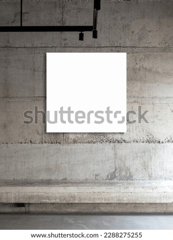 A white blank template of square picture frames, vertical style. Empty square artist canvas space hanging on concrete wall background over empty cement long bench seat.