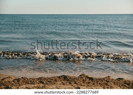 seascape in calm, sunny weather at sunset