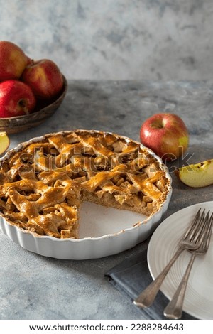 Whole apple pie, homemade fresh fruit pie with red apples. Copy space. Royalty-Free Stock Photo #2288284643
