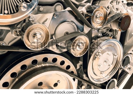 pulley belts car engine background Royalty-Free Stock Photo #2288303225