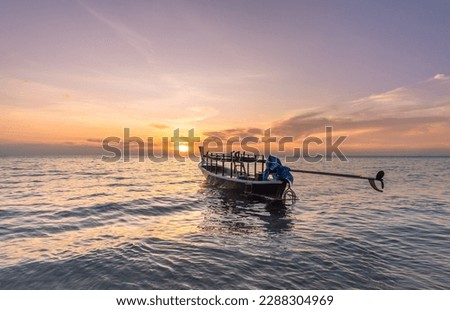 A lonely thai boat at sunset in thailand
