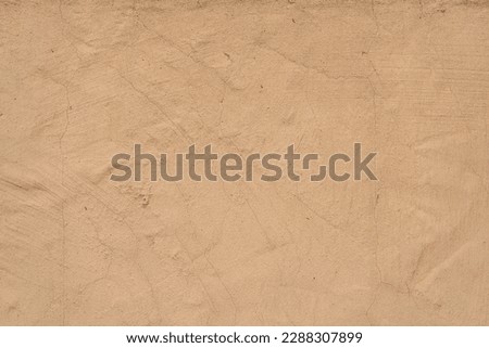 Old traditional house wall texture. Brown beige sandy color rough plaster background. Royalty-Free Stock Photo #2288307899