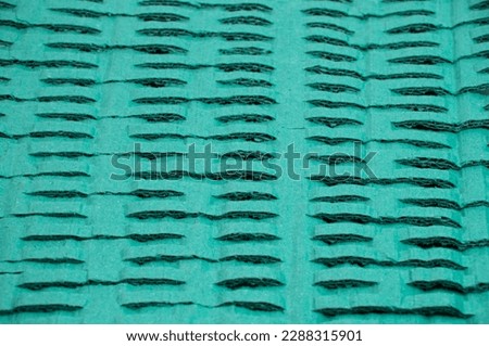 background with craft turquoise paper. beige material close up. cardboard production concept