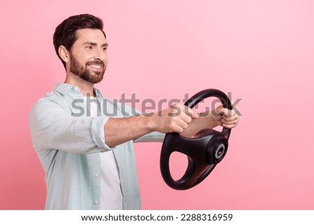 Photo of young man brunet hair driver business assistant hold steering wheel wear shirt kia rio advert isolated on pink color background Royalty-Free Stock Photo #2288316959