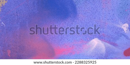 Messy paint strokes and smudges on an old painted wall with graffiti. Colorful drips, flows, streaks of paint and paint sprays Royalty-Free Stock Photo #2288325925