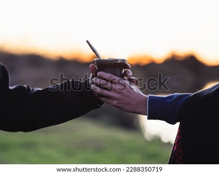 Two friends sharing some Argentine Mate. It is a typical Argentine infusion, and just like this image, it represents friendship and unity; both characteristic qualities in Argentina.  Royalty-Free Stock Photo #2288350719