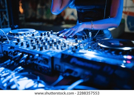 a dj playing a dj instrument at a clubbing event in bali Royalty-Free Stock Photo #2288357553