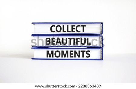 Collect beautiful moments symbol. Books with words 'Collect beautiful moments'. Beautiful white background. Business, collect beautiful moments concept, copy space.