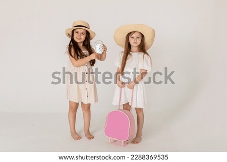 Vacation time concept. Beautiful happy kids smiling isolated on white background. Tourists going to summer vacation.Travel trip funny.Two Friend happy travel .