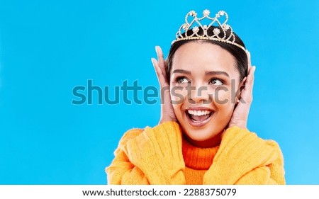 Mockup, crown or happy with woman in studio for celebration, princess and party. Smile, beauty and fashion with female tiara on blue background and excited for achievement, winner and wow prom event