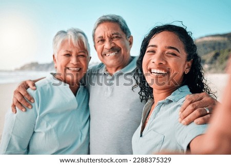 Senior parents, daughter and beach selfie with smile, hug and happiness in summer sunshine for social media. Women, man and portrait with happy, excited face and profile picture with love on holiday
