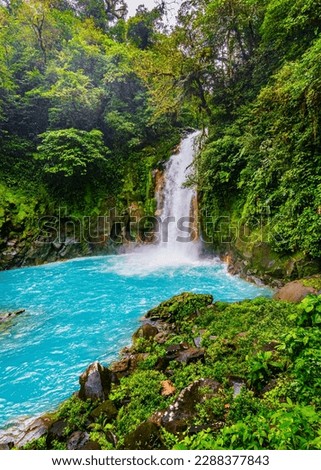 Rio Celeste Waterfall and pond in Tenorio Volcano National Park, Alajuela Province, Costa Rica Royalty-Free Stock Photo #2288377843