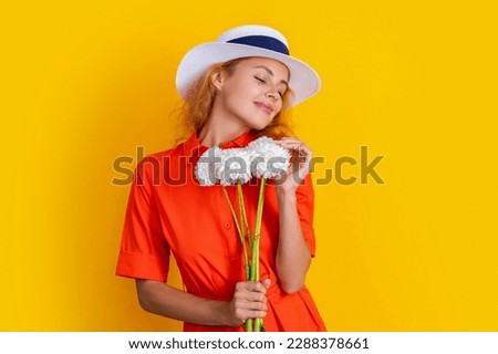 smiling retro summer woman with flowers in studio. retro summer woman with flowers