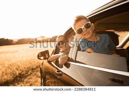  Family road trip. Happy mother and little boy in the car. Family road trip, summer holiday travel. Royalty-Free Stock Photo #2288384811