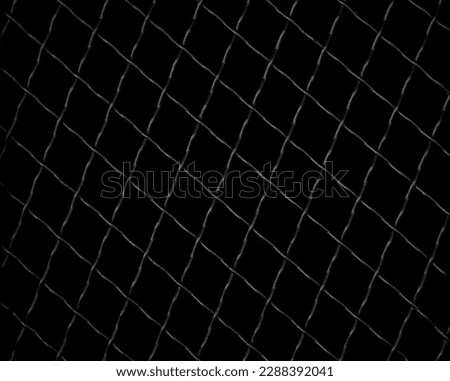 Trellised window. Metal lattices with rhombus pattern. Close-up image. isolated on black background.  Window with Wrought Iron Security Bars. 