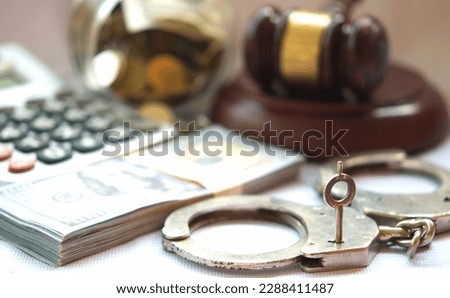 Money and finance crime includes fraud, embezzlement, money laundering, insider trading, and cybercrime. These illegal activities pose significant threats to the financial system. Royalty-Free Stock Photo #2288411487