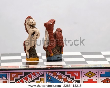Inca version chess. Incas vs Spanish. Horse and llama  on chessboard.