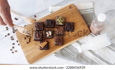 brownies top view wooden cutting board , top view cake on table marble with napkin milk , top view cookies wooden cutting board, cookies flat lay photography