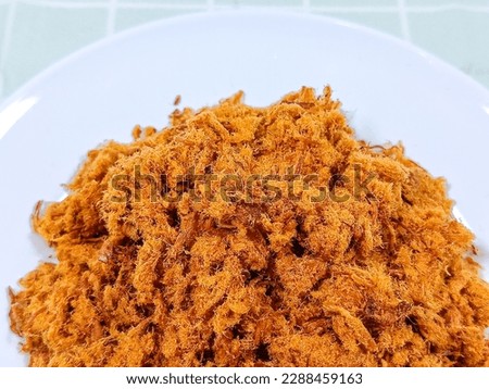 Close-up view of sweet chicken floss. Indonesian called it abon ayam. Abon ayam tastes sweet, sometimes spicy. It's best served with a plate of warm rice. A famous condiment from Indonesia. Royalty-Free Stock Photo #2288459163