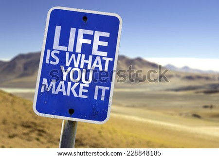 Life is What You Make It sign with a desert background