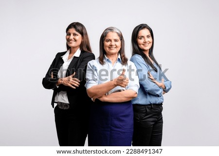 Confident indian businesswoman or employee standing on white background. Royalty-Free Stock Photo #2288491347