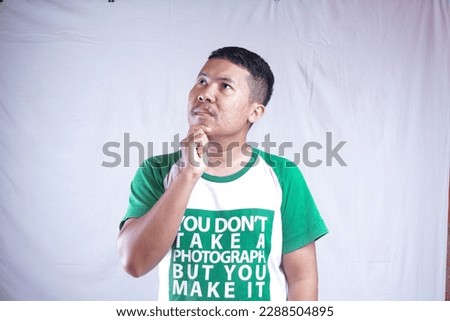 A man is showing the expression in front of white background.
