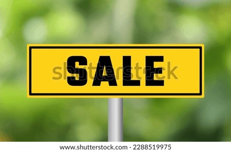 Sale road sign on blur background