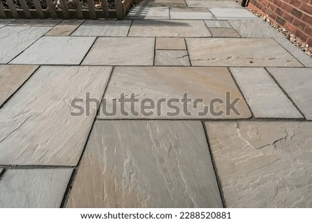 Warm paving slabs in garden, background and material concept illustration.