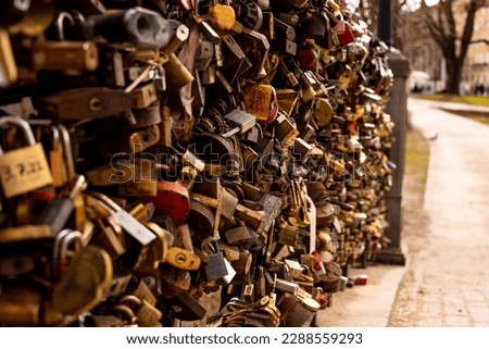 Many locks of love hang on the bridge. To prove their love, couples put padlocks on the railing of the bridge, and to make sure it lasts forever, they throw the key into the river below.