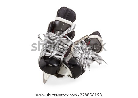 Pair of hockey skates black with gray laces isolated on white background